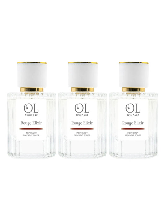Three bottles of OL Skincare Rouge Elixir perfume on a white background
