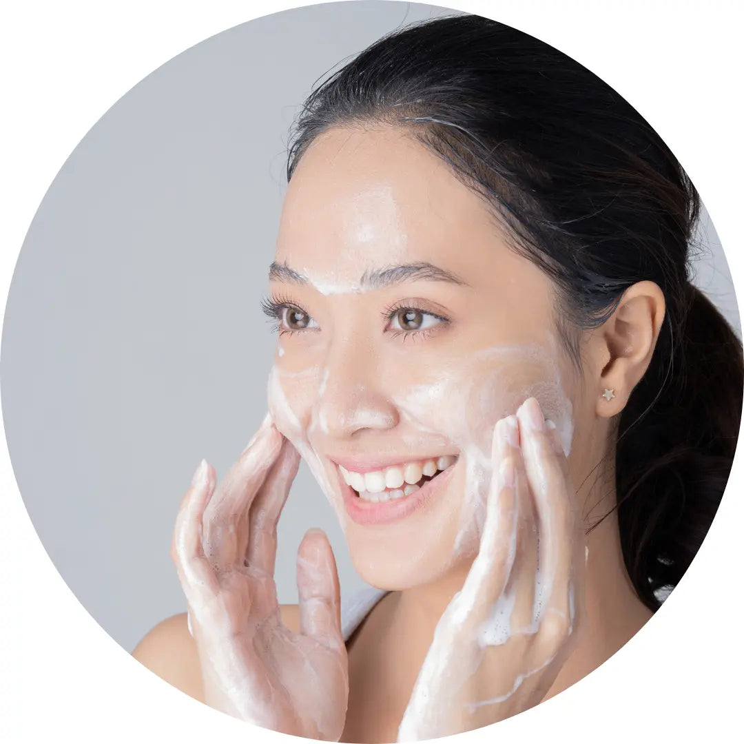 asian woman using buddha beauty cream cleanser