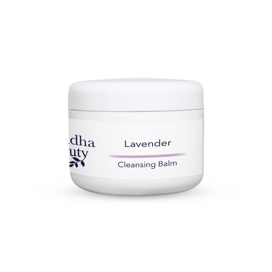 lavender face cleansing balm. cleansing balm in a white jar on a white back drop, vegan facial cleanser balm, facial balm, vegan cleansing balm in buddha beauty label, white lab