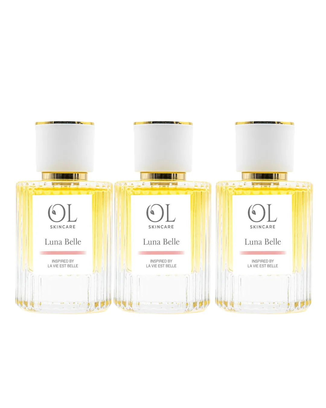 Three bottles of Luna Belle perfume  on a white background