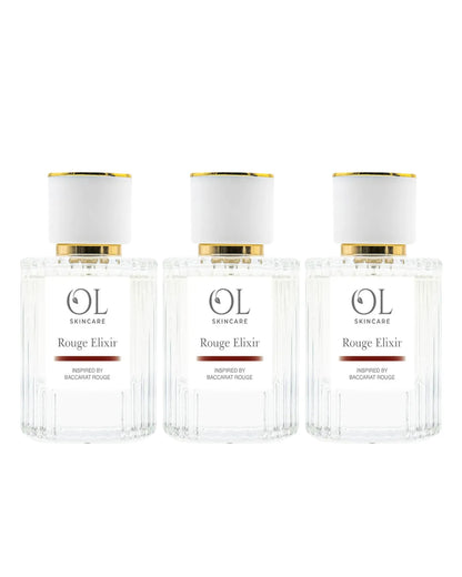 Three bottles of OL Skincare Rouge Elixir perfume on a white background
