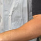 spf 50 being applied to a dark skin arm