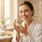 Woman using turmeric clay mask in bathroom